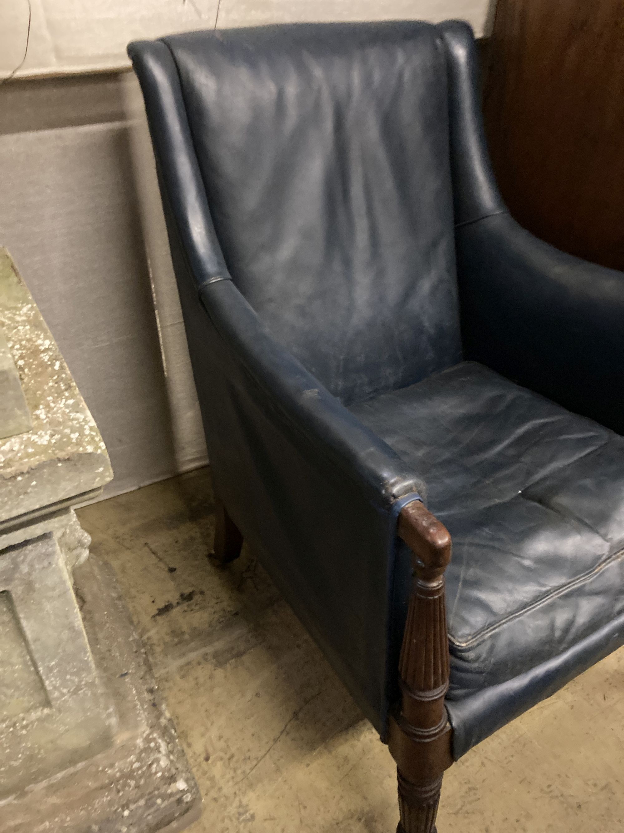 A Regency mahogany library chair, upholstered in blue leather, width 65cm depth 75cm height 93cm